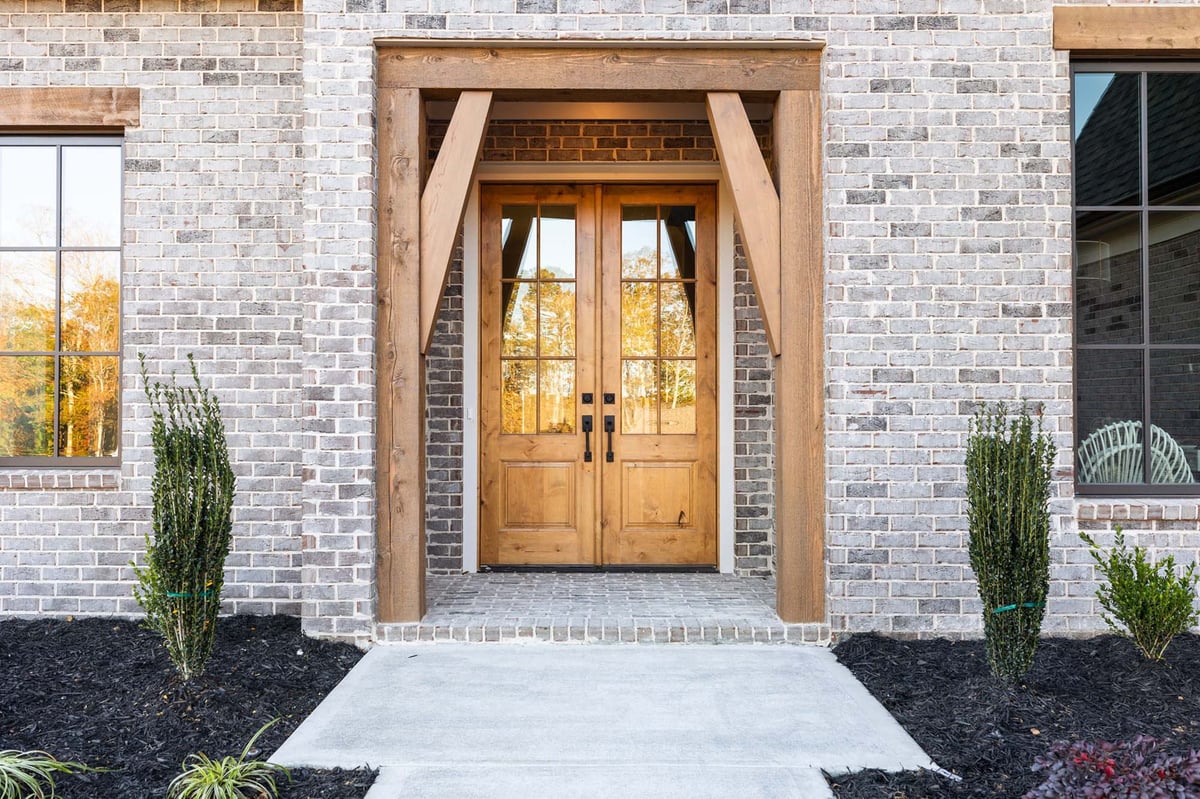 atlanta custom home entryway with wood beams