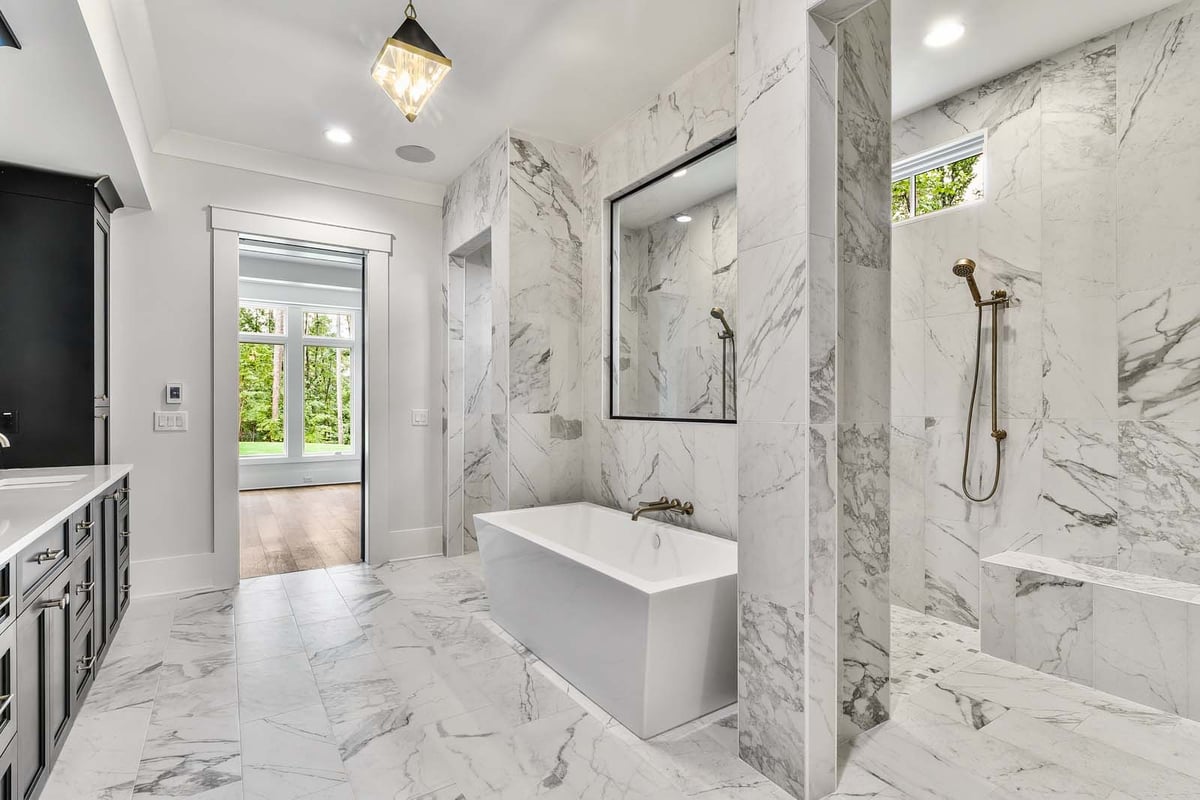 atlanta custom home modern bathroom with light granite and bathtub