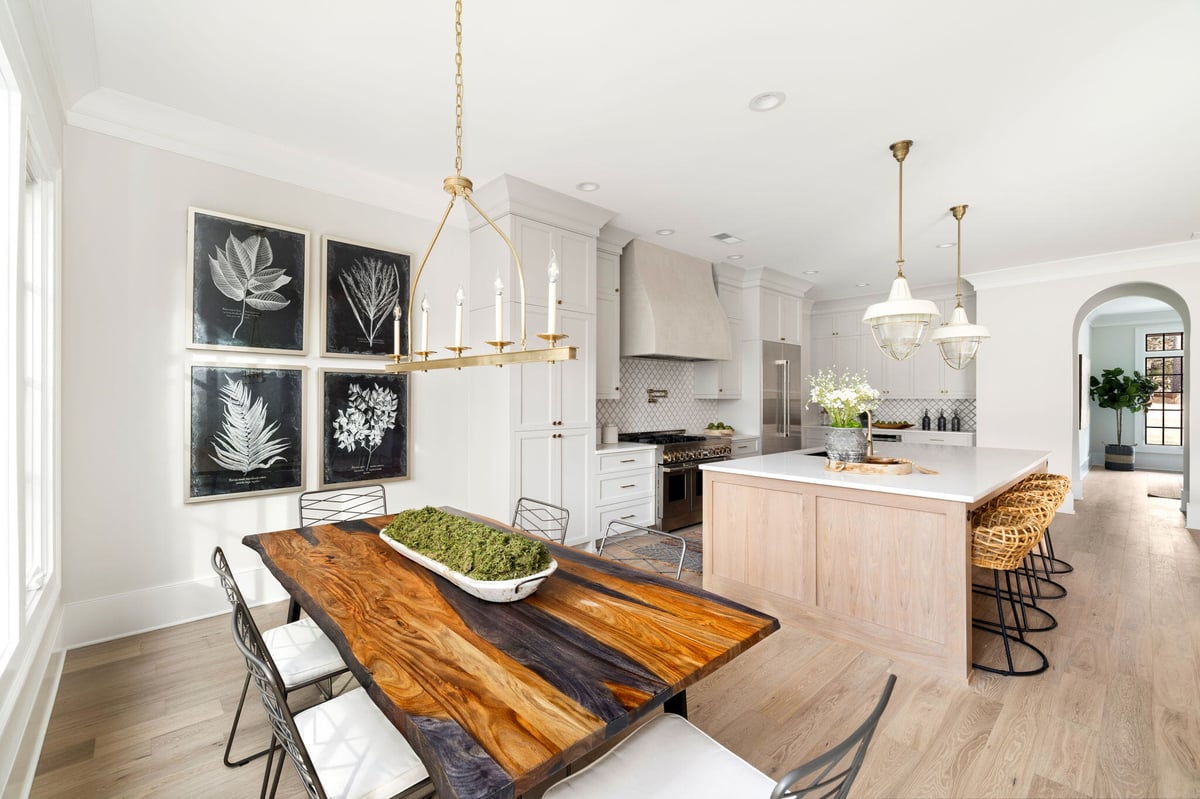 Kitchen With Large Island and Seating and Dining Room Table 