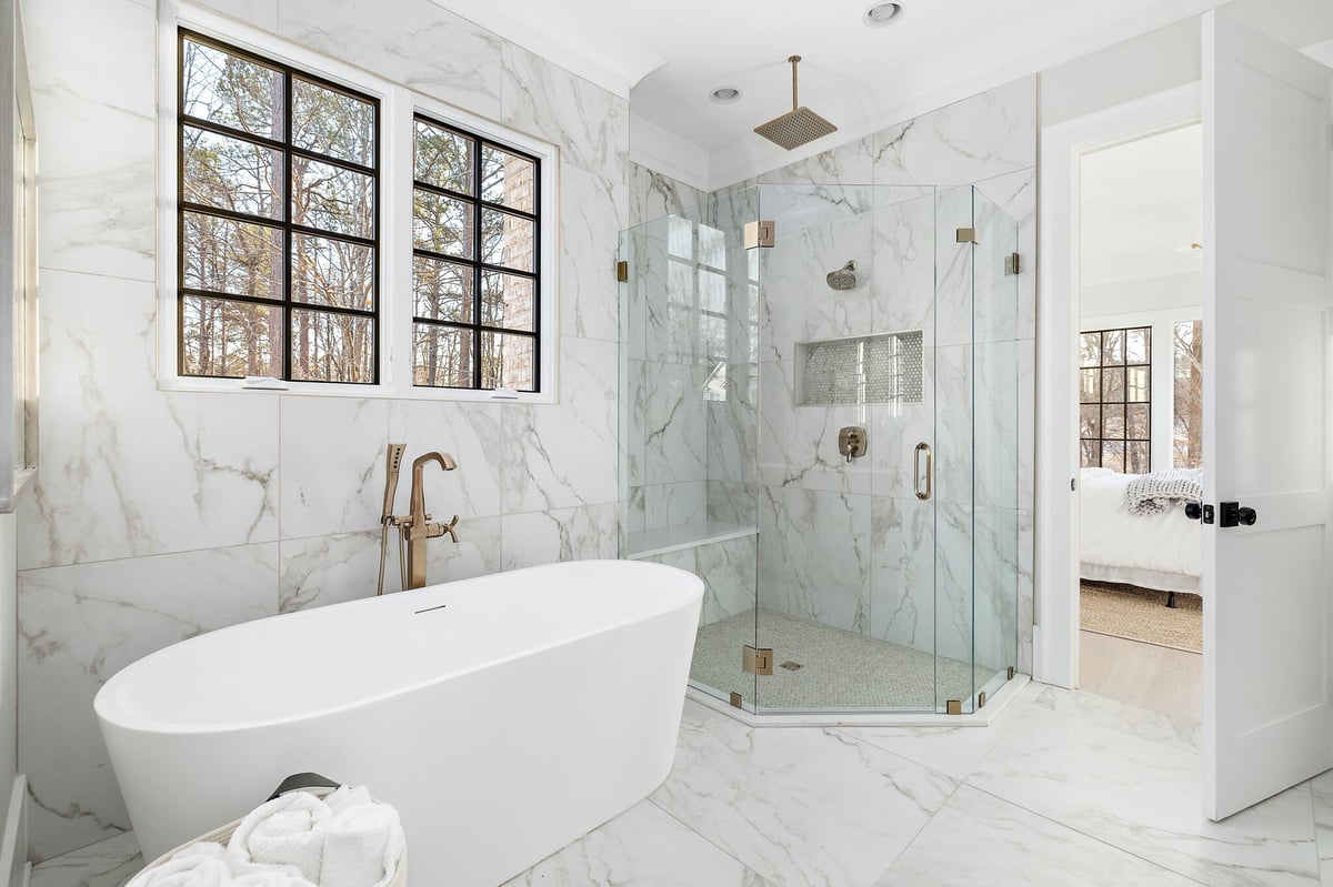 Large White Soaking Tub in Large Tiled Bathroom in New Home in Acworth