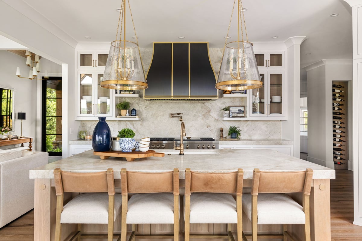 Kitchen Island with Stools and Custom Black Range Hood in Atlanta Home Remodel