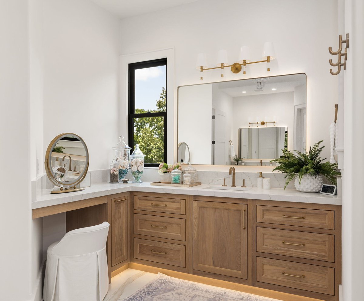 Primary Full Bathroom with Seated Vanity and Large Window in Home Remodel